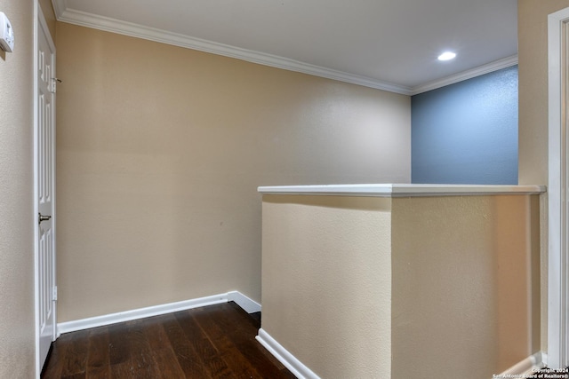 hall with dark hardwood / wood-style flooring and crown molding