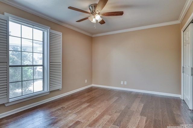 spare room featuring ceiling fan, crown molding, and hardwood / wood-style flooring