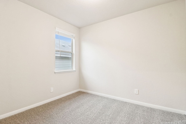 empty room with carpet flooring