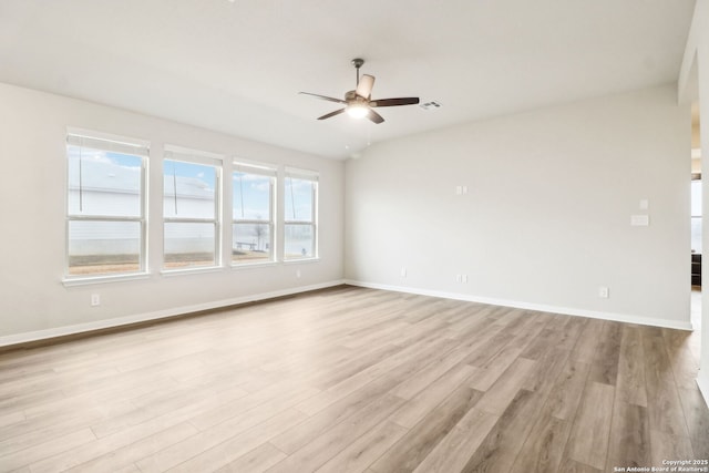 spare room with light hardwood / wood-style flooring and ceiling fan