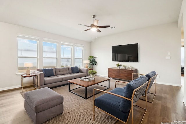 living room with lofted ceiling, wood-type flooring, and ceiling fan