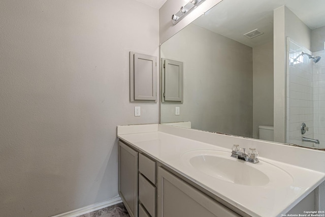 bathroom featuring toilet and vanity