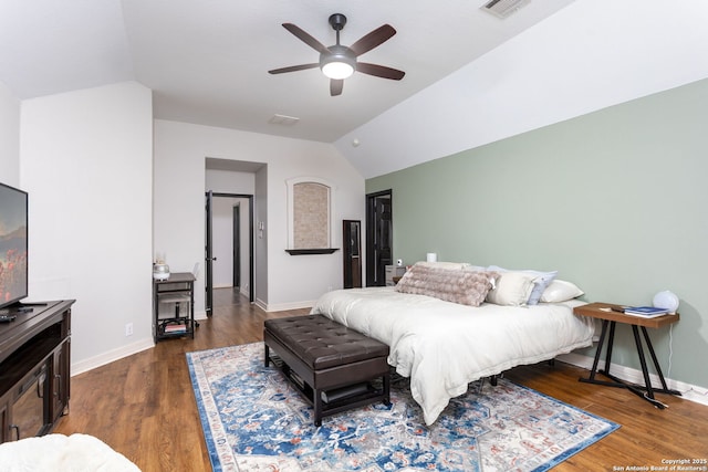 bedroom featuring ceiling fan, vaulted ceiling, and dark wood-type flooring