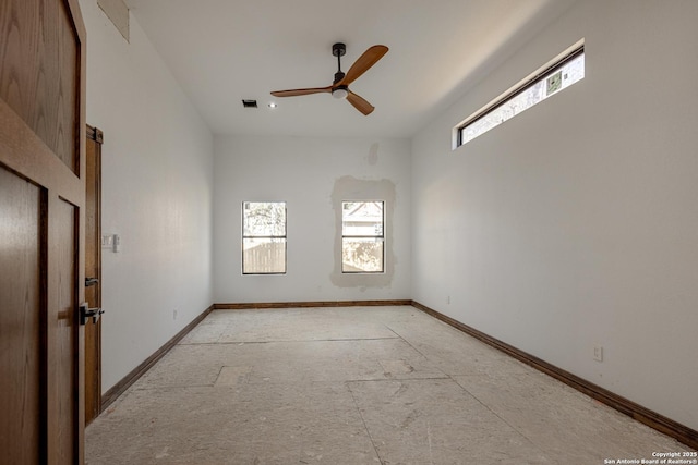 empty room with ceiling fan and a healthy amount of sunlight