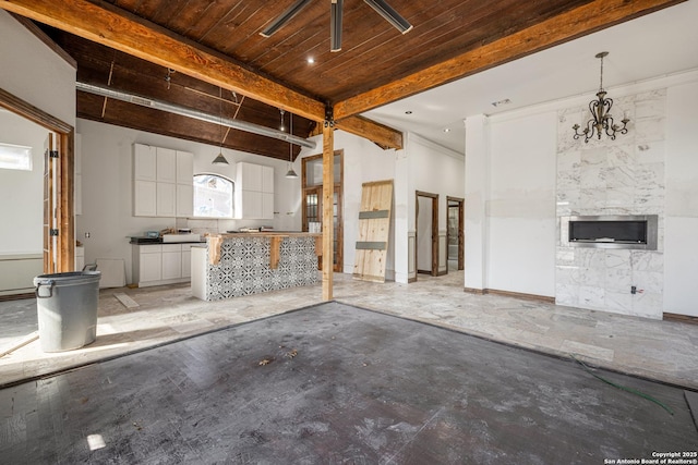 interior space featuring beamed ceiling and wooden ceiling