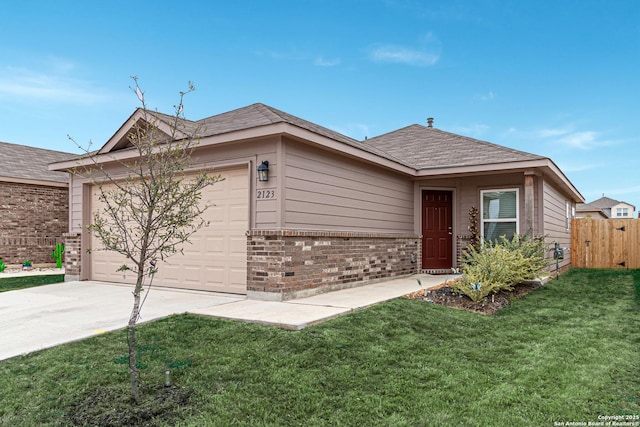 ranch-style home featuring a garage and a front yard