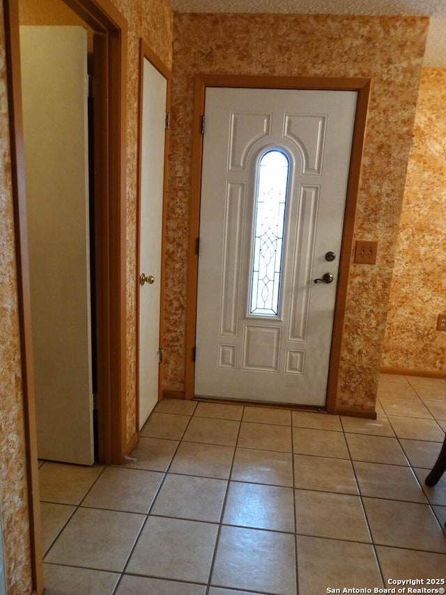 foyer with light tile patterned flooring