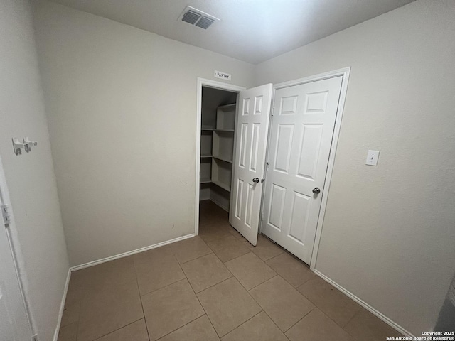 unfurnished bedroom with a closet