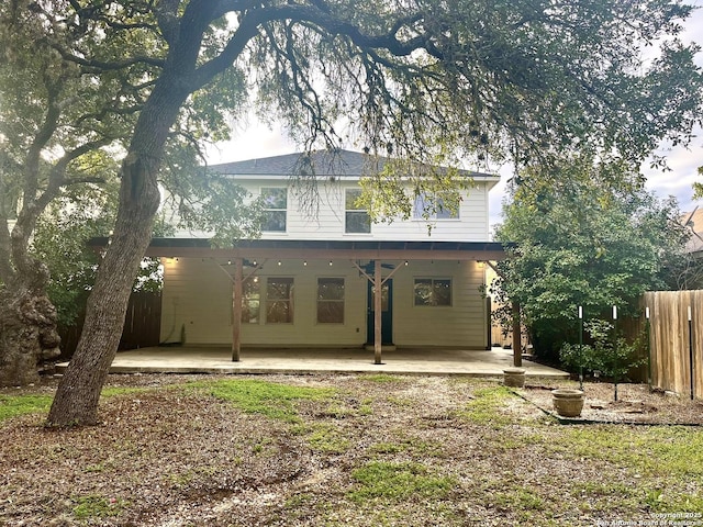 back of house with a patio