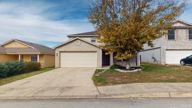 view of front of house with a front yard and a garage