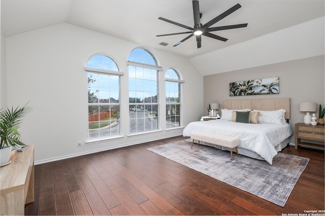 bedroom featuring ceiling fan, dark hardwood / wood-style floors, and lofted ceiling