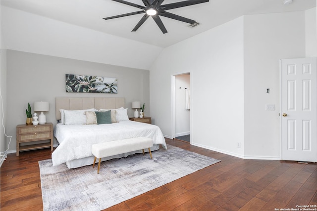 bedroom with ceiling fan, dark wood-type flooring, and lofted ceiling