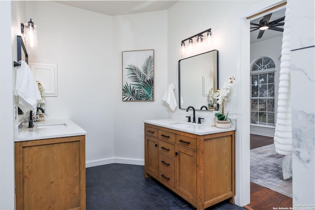 bathroom featuring ceiling fan, hardwood / wood-style flooring, and vanity