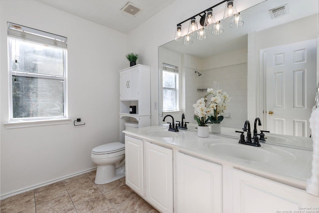 bathroom featuring tile patterned floors, toilet, and vanity