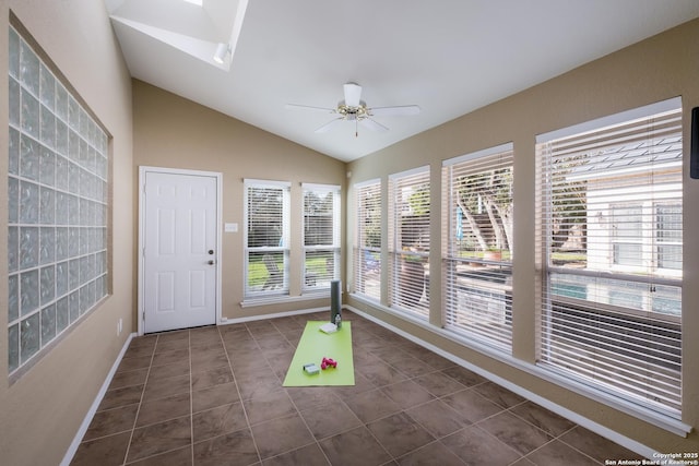 unfurnished sunroom featuring ceiling fan and lofted ceiling