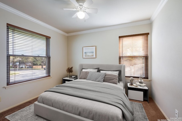 carpeted bedroom featuring ceiling fan and ornamental molding