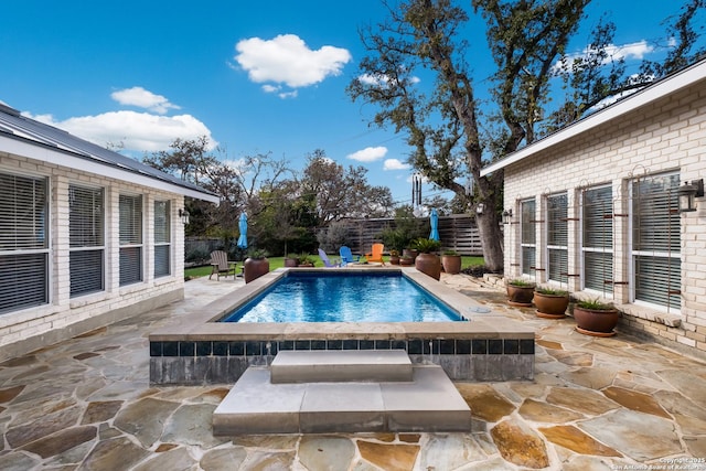 view of swimming pool with a patio