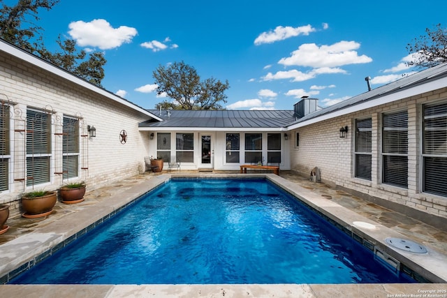 view of pool featuring a patio area