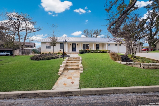 ranch-style house with a garage and a front lawn