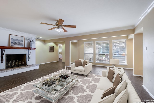 living room with ceiling fan, dark tile patterned floors, and crown molding