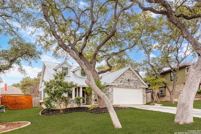 view of front of home featuring a front yard and a garage