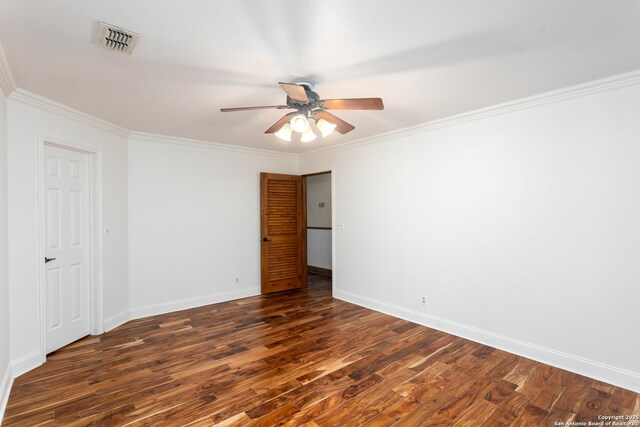 spare room featuring ceiling fan, dark hardwood / wood-style flooring, and ornamental molding