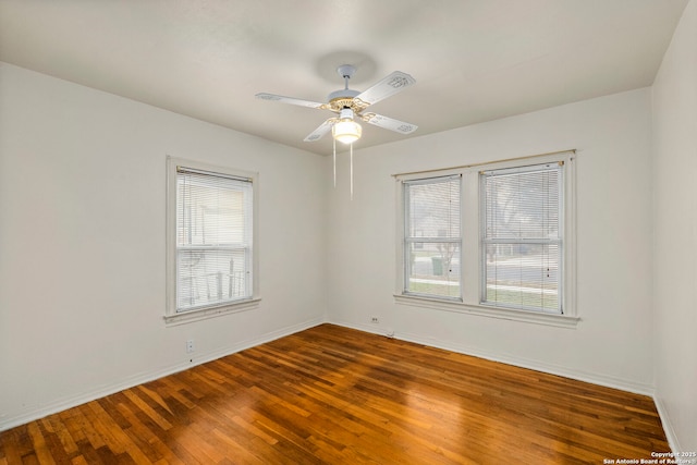 empty room featuring ceiling fan and hardwood / wood-style flooring