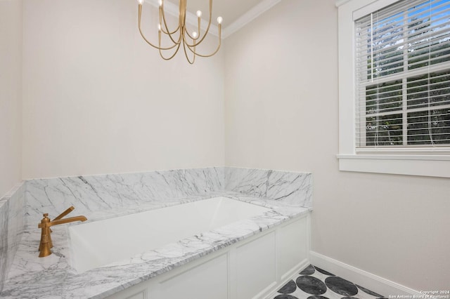 bathroom with an inviting chandelier and a bath