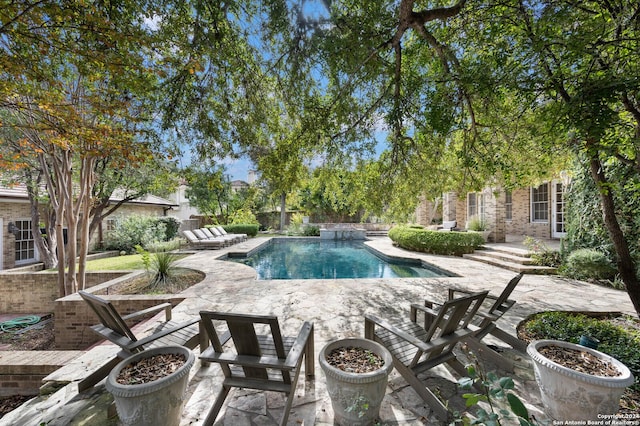 view of pool featuring a patio