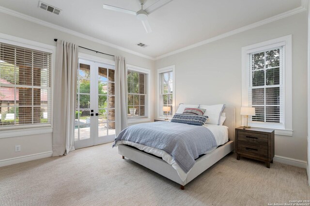 bedroom with ceiling fan, multiple windows, light carpet, and access to outside