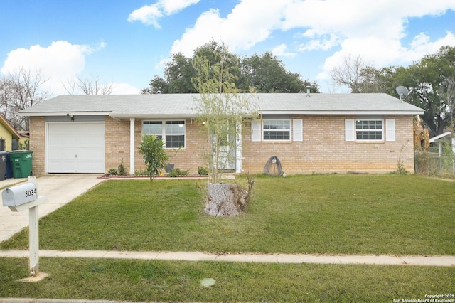 ranch-style house featuring a garage and a front lawn