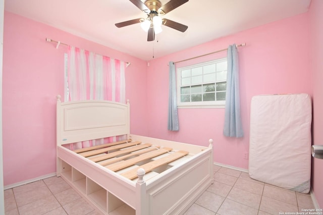 unfurnished bedroom featuring ceiling fan and light tile patterned floors