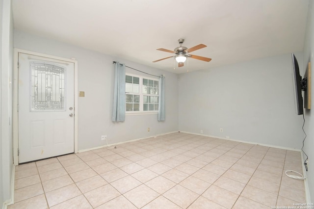 tiled entryway featuring ceiling fan