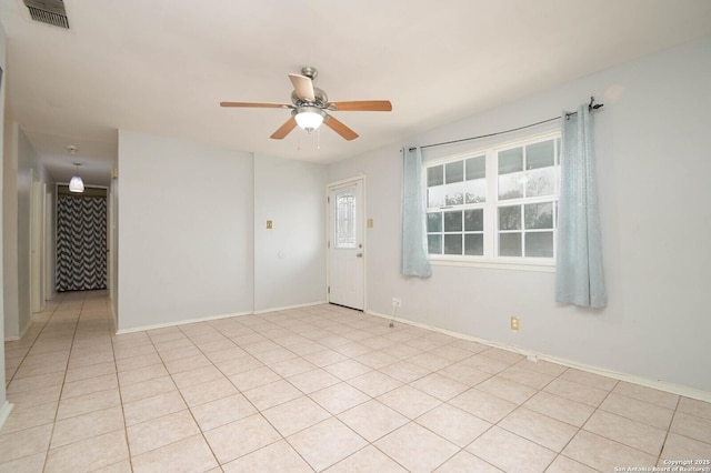 unfurnished room featuring ceiling fan and light tile patterned flooring