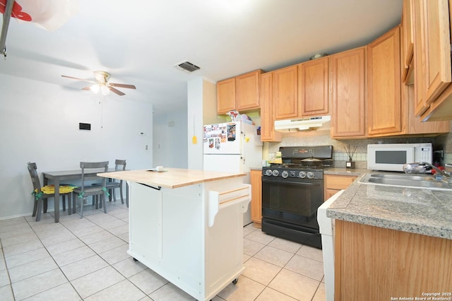 kitchen featuring white appliances, tasteful backsplash, sink, ceiling fan, and light tile patterned floors