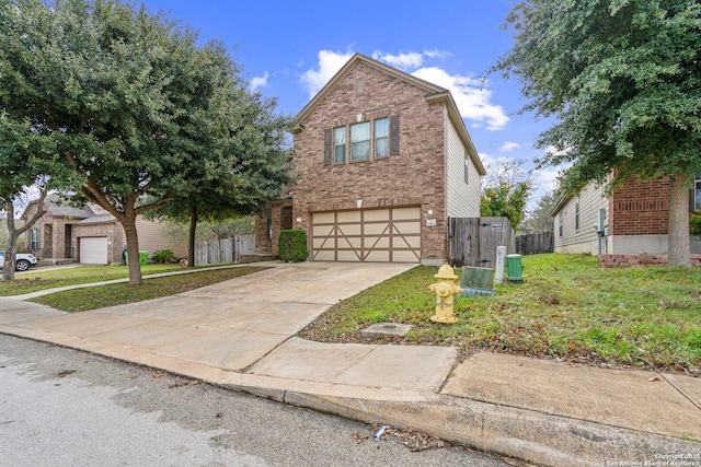 view of property featuring a front lawn and a garage