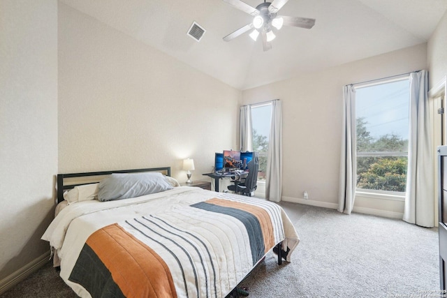 carpeted bedroom with ceiling fan and vaulted ceiling