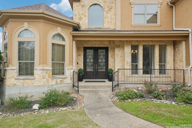 property entrance featuring french doors