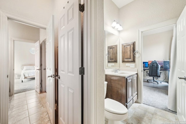 bathroom with tile patterned floors, toilet, and vanity