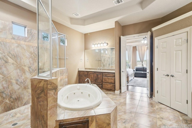 bathroom featuring vanity and shower with separate bathtub