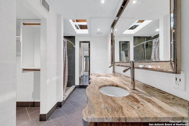 bathroom featuring a shower with curtain and tile patterned floors