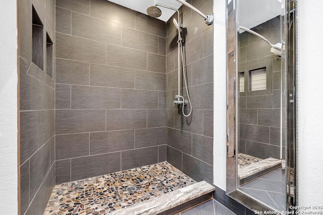 bathroom featuring a tile shower