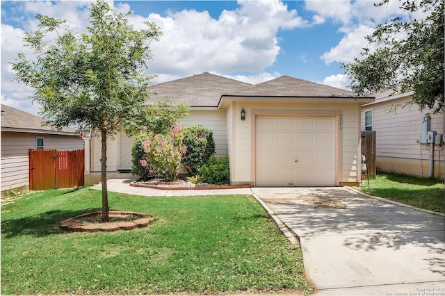 ranch-style house featuring a front lawn and a garage