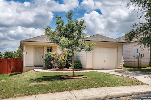 ranch-style home with a front yard and a garage