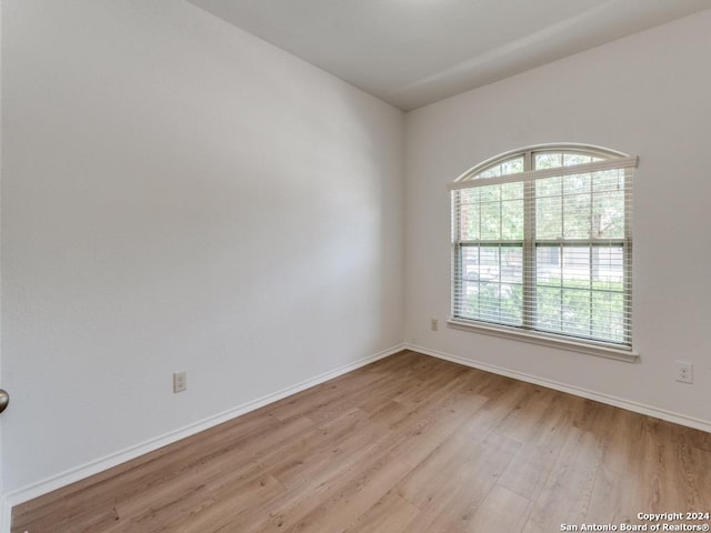 unfurnished room featuring light hardwood / wood-style floors