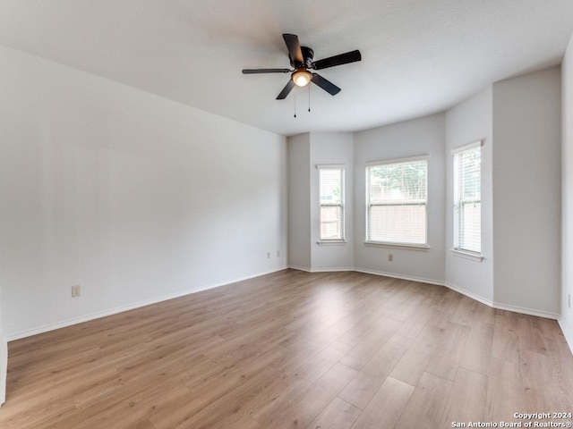 unfurnished room with light hardwood / wood-style floors and ceiling fan