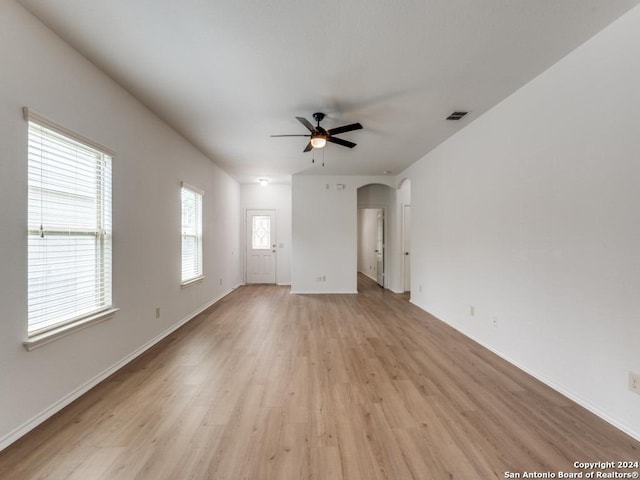 unfurnished room featuring ceiling fan and light wood-type flooring