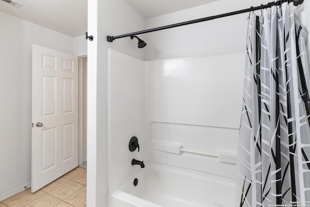 bathroom featuring shower / bathtub combination with curtain and tile patterned flooring