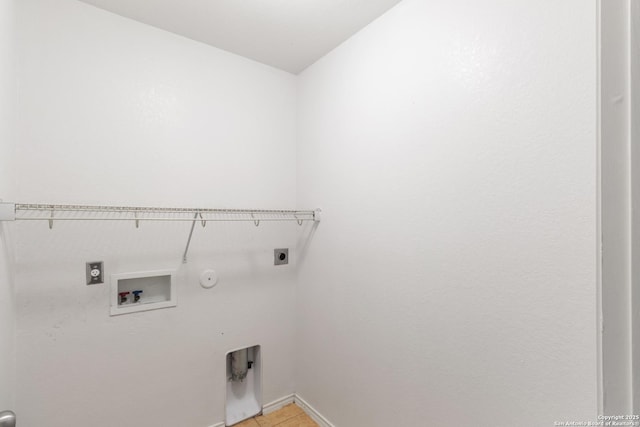 clothes washing area with washer hookup, gas dryer hookup, and hookup for an electric dryer