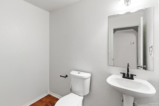 bathroom featuring toilet and sink